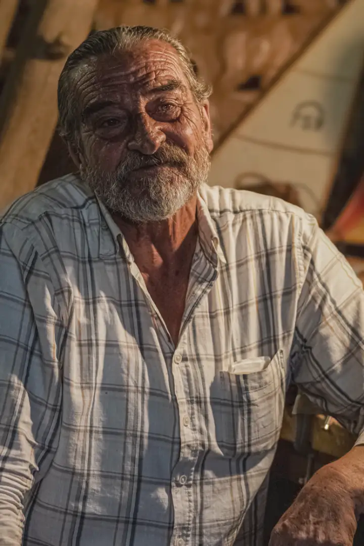Walt K., a retired contractor, at the bench in his woodshop