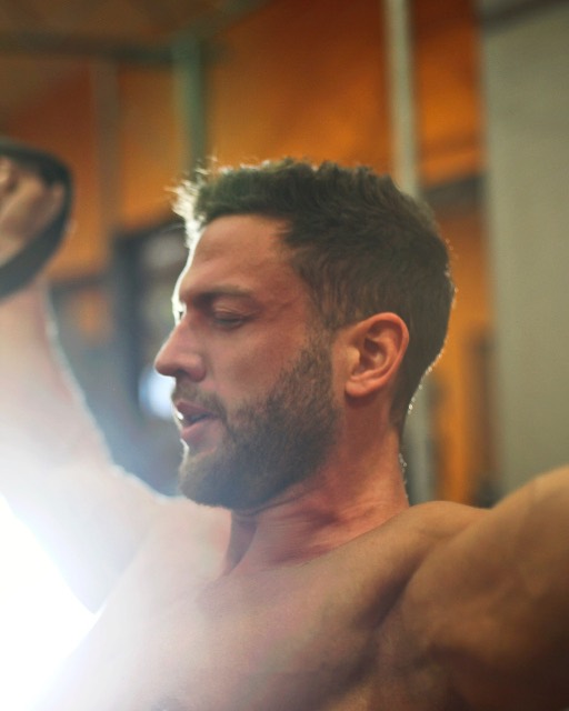 Theo Lindgren pulling a suspension strap mid-exercise